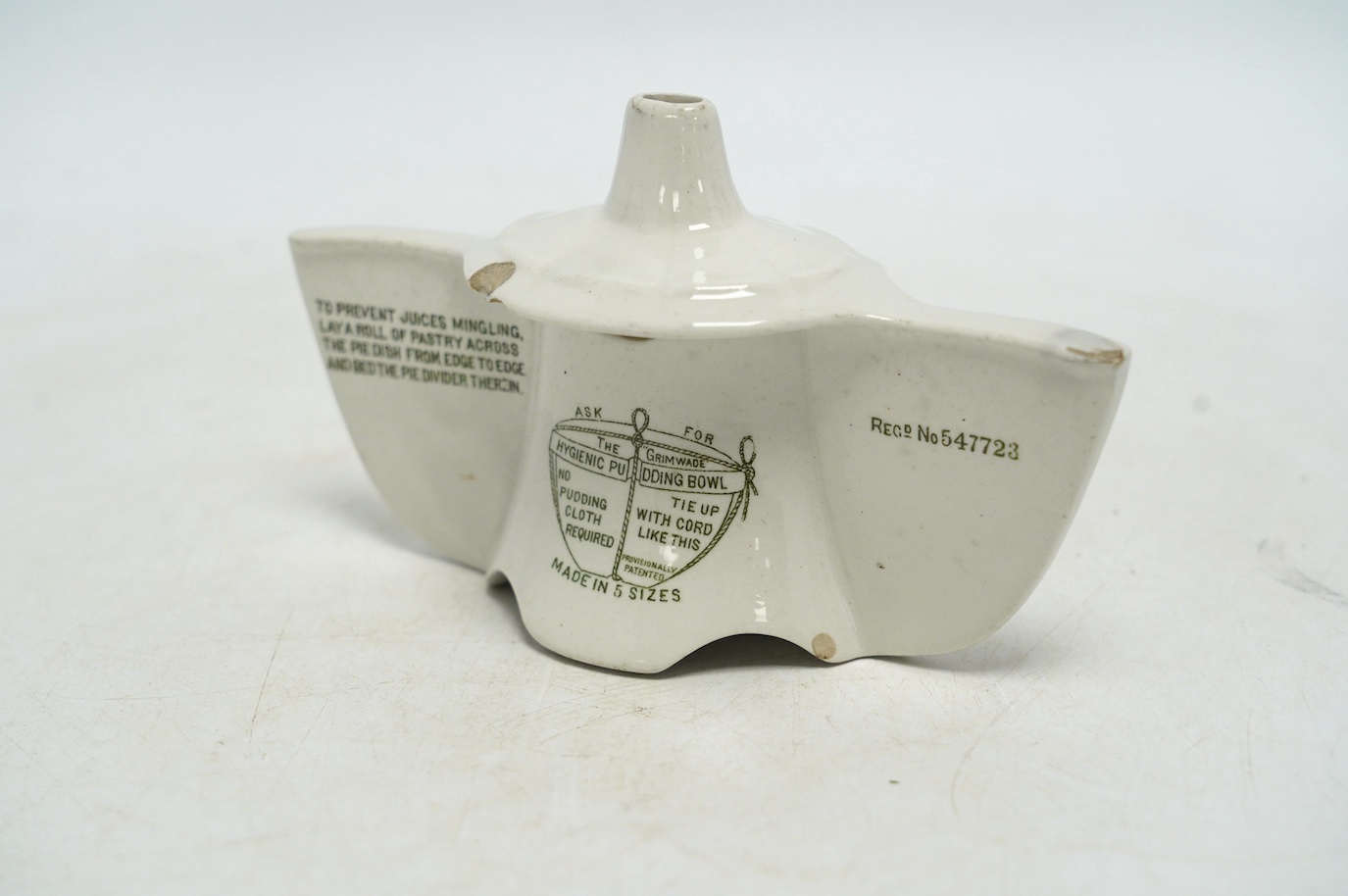 A Grimwades green printed Bleriot pie divider, 15.5cm wide, 9.5cm high. Condition - poor to fair